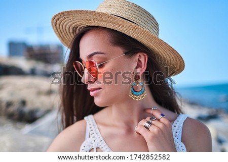 Foto stock: Portrait Of Beautiful Brunette Woman With Big Earring And Shinny Yellow Accessories In Hair Perfect