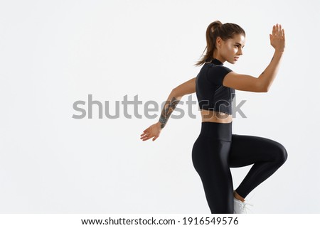 Foto stock: Young Woman Doing Exercises On White