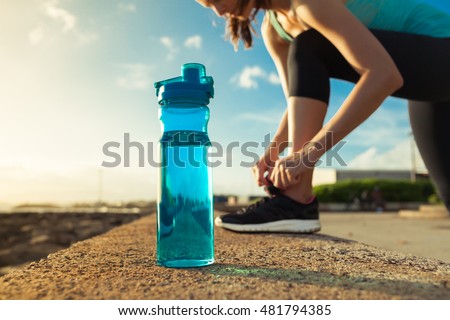 Stock photo: Running Girl With Bottle Of Water