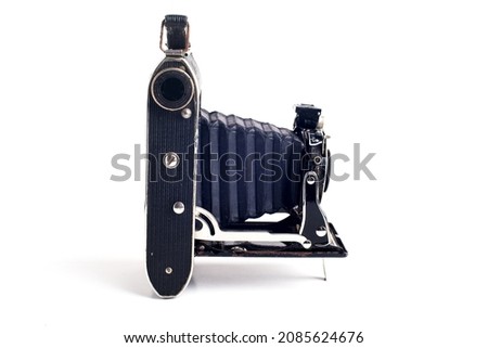 ストックフォト: Vintage Folding Bellows Roll Film Camera In Profile