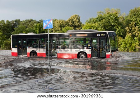 ストックフォト: Cars Trying To Drive Against Flood On The Street In Gdansk Poland