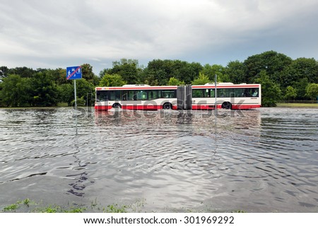 Zdjęcia stock: Bus Trying To Drive Against Flood On The Street In Gdansk Poland
