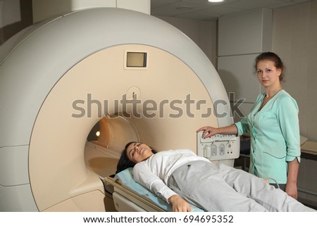 Foto stock: Doctor With Patient Having A Computerized Axial Tomography Cat