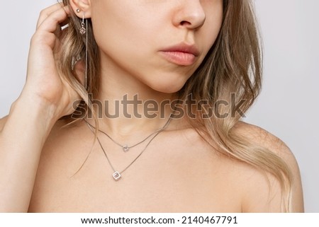 Сток-фото: Close Up Shot Of Young Woman Wearing Silver Corset With Stars