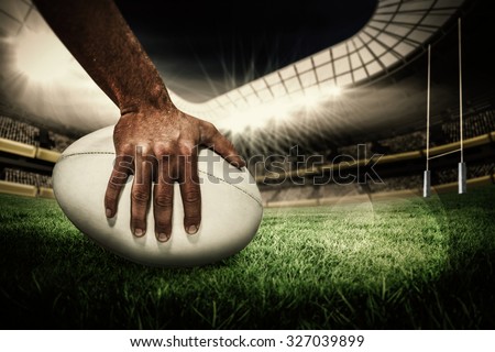 Zdjęcia stock: Composite Image Of Rugby Player Holding A Rugby Ball