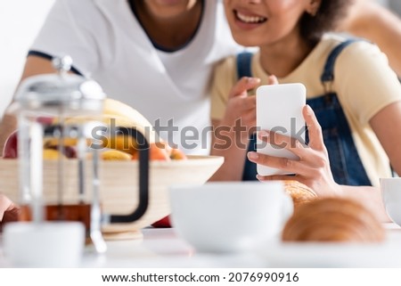 Stock fotó: Crop Woman Using Smartphone During Breakfast
