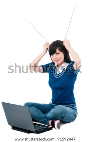 Foto d'archivio: Young Woman With Laptop And Holding Antennas On Head