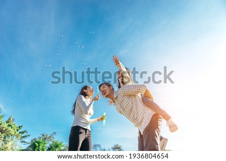 Stock photo: Parents And Children Relaxing At A Picnic