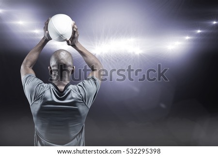 商業照片: Composite Image Of Athlete Throwing Rugby Ball 3d