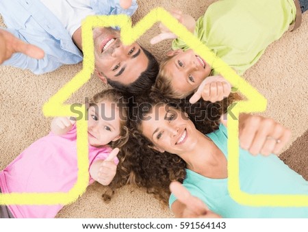 Foto stock: Family Laying On The Rug At Home Against House Outline In Background