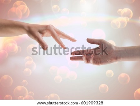 Stock foto: Composite Image Of Two Hands Against A Shining Background