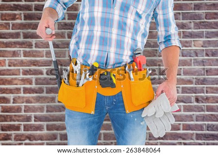 Foto stock: Midsection Of Handyman With Tools