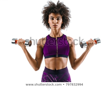 Foto stock: Sporty Girl Doing Exercise With Dumbbells