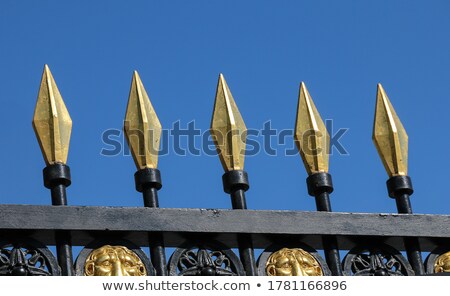 Foto stock: Steel Fence With Gold Spears