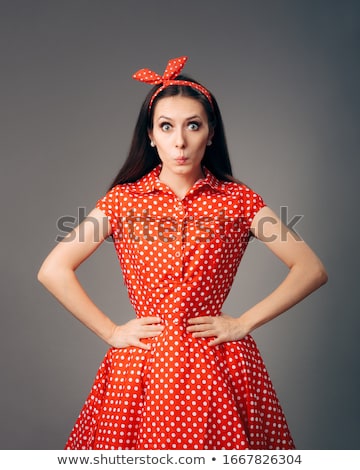 Foto d'archivio: Retro Fashion Model In Red Polka Dots