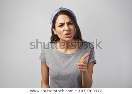 Stock photo: Frowning Woman Pointing Her Finger