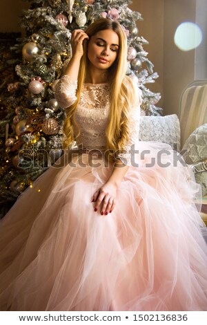 Foto d'archivio: Smiling Blonde In White Dress Looking Like A Bride