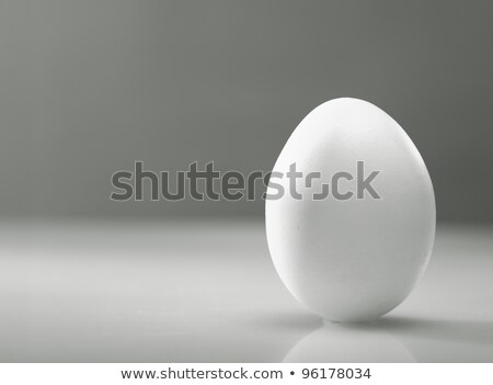 Stock foto: Simple As White Egg Over Desk With Reflection And Shadow