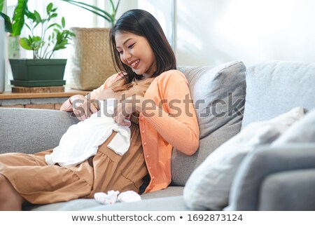 Stockfoto: Woman Planning Purchases Newborn Baby
