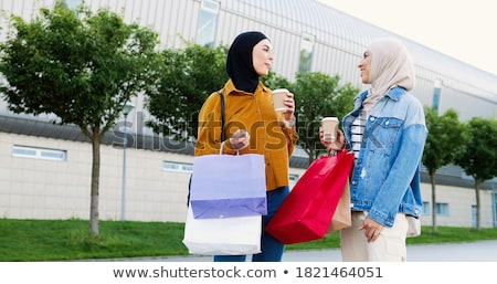Stock photo: Two Stylish Women Chatting Outdoors In A Town