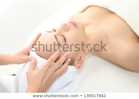 Attractive Young Woman Receiving Facial Massage Stock foto © sunabesyou