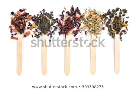 Foto stock: Dried Hibiscus Tea Leaves Scattered On White