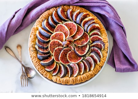 Stock photo: Woman Icing Sugar On Tart