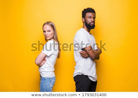 Stock photo: Screaming Emotional Young Cute African Couple Posing Isolated Over Yellow Background