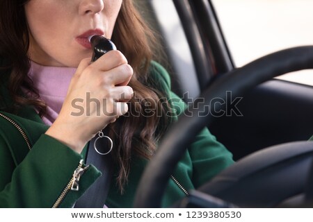 Zdjęcia stock: Woman Sitting Inside Car Taking Alcohol Test