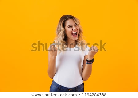 Foto stock: Photo Of Young Blond Woman In Basic Clothing Yelling And Clenchi