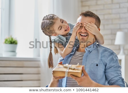 Stockfoto: Mother With Baby Giving Birthday Present To Father