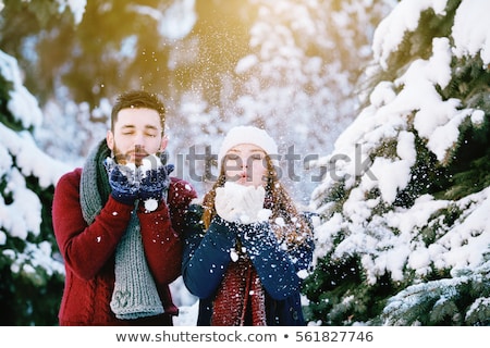 Zdjęcia stock: Cheerful Woman In A Scarf And Warm Clothes On The Background Of The Winter Forest