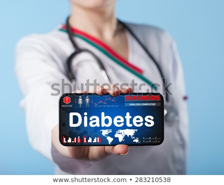 Zdjęcia stock: Doctor Holding Laptop With Diabetes Text