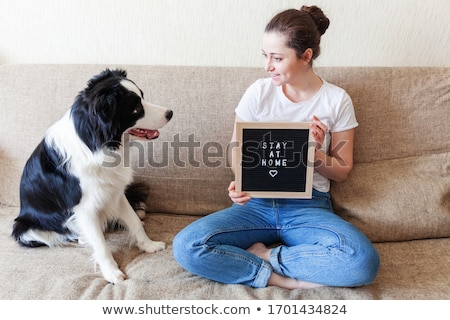 Foto stock: Woman With Board And Inscription Stay Home