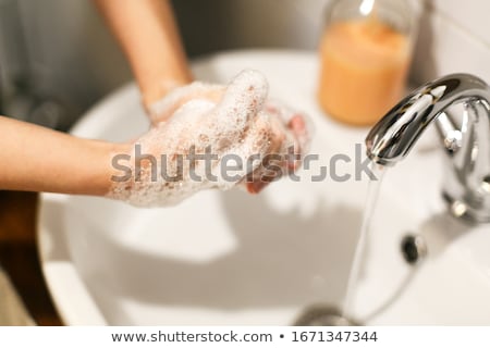 Foto stock: Washing Hands Rubbing With Soap Proper Technique Under Bathroom