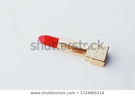 [[stock_photo]]: Luxury Lipstick In A Golden Tube On White Marble Background Make Up And Cosmetics