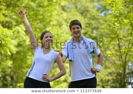 Fit Athletic Couple Relaxing In The Park [[stock_photo]] © dotshock