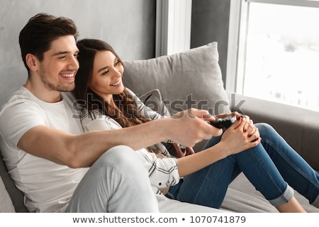 Stockfoto: Man On The Sofa With Remote Control Rejoice