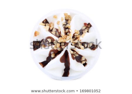Foto stock: Chocolate Flavor Ice Cream In A Waffle Cone With Chocolate Sauce And Brittle