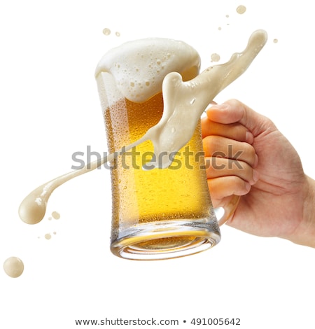 Foto stock: Hand Holding Mug With Splashing Beer