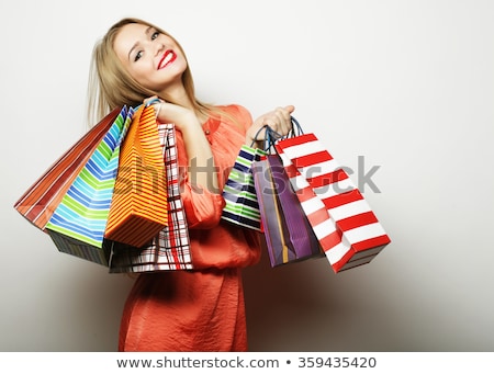 Foto stock: Portrait Of Young Happy Smiling Woman With Shopping Bags