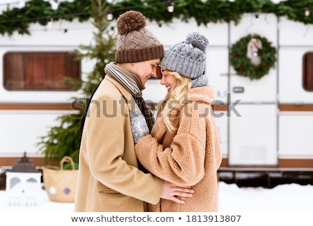 Stok fotoğraf: Young Couple Hugging In Winter Forest