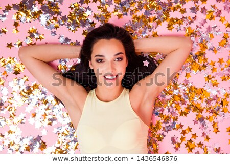 Сток-фото: Happy Woman With Sequins On Her Face Lying And Smiling