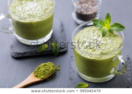 Сток-фото: Matcha Green Tea Chia Seed Pudding Dessert With Fresh Mint And Coconut On A Black Slate Background