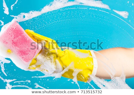 Foto stock: Hand Cleaning Glass Window Pane With Detergent