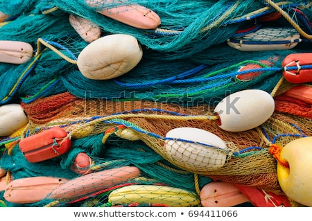 Stockfoto: Pile Of Commercial Fishing Net With Cords And Floats