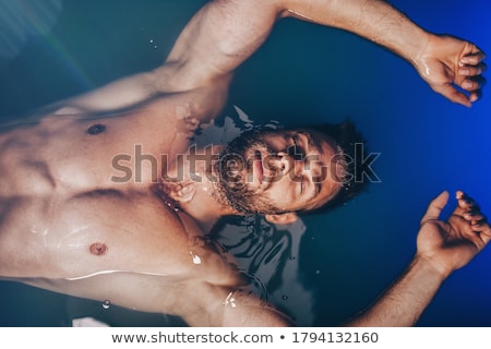 Stock foto: People And Floating Tank With Blue Water