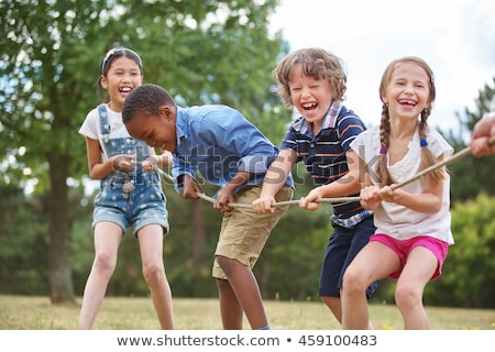 Foto stock: Children Playing Sports In The Park