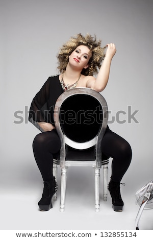 [[stock_photo]]: Beautiful Woman With Curve Hair In Black Ransparent Blouse Posin