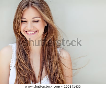 Stock fotó: Attractive Young Woman With A Happy Sweet Smile